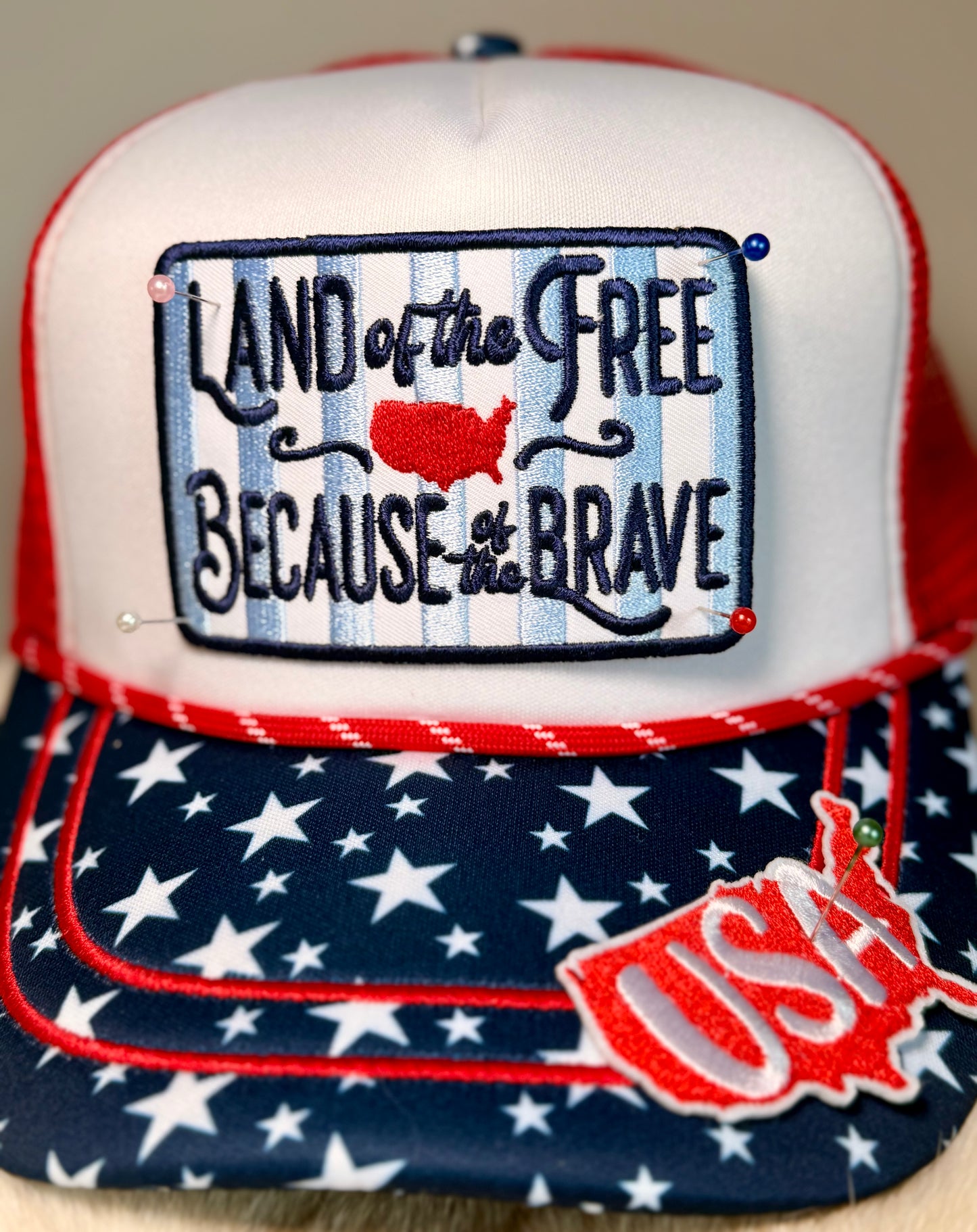 Land of the Free Patriotic Trucker Hat | USA Patch Hat with Star Brim Accent | Fourth of July Boutique Snapback